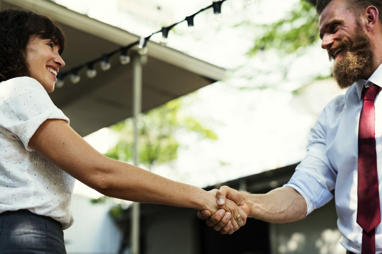 man and woman shaking hands