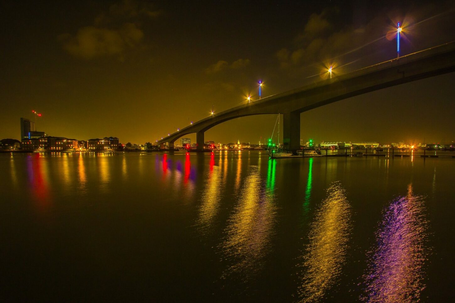 students looking at the bridge from afar at night