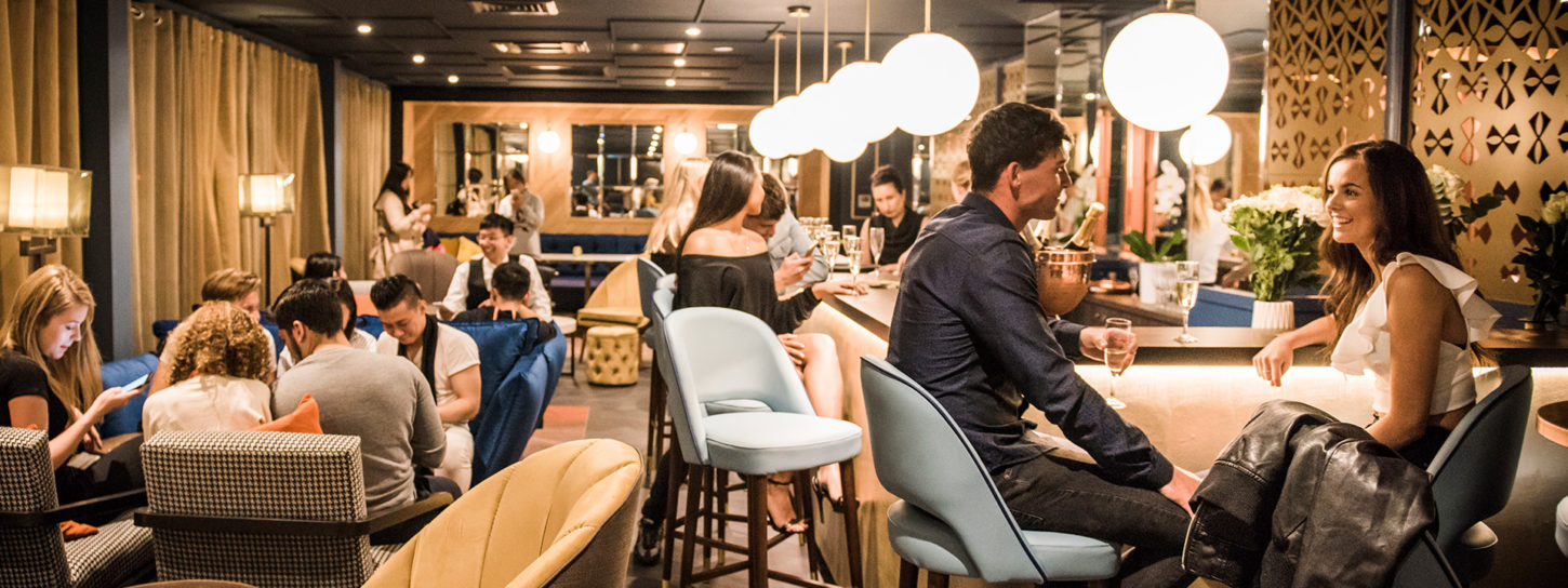 students socialising in a bar