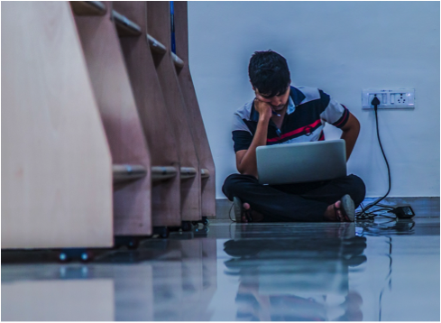 student studying with laptop