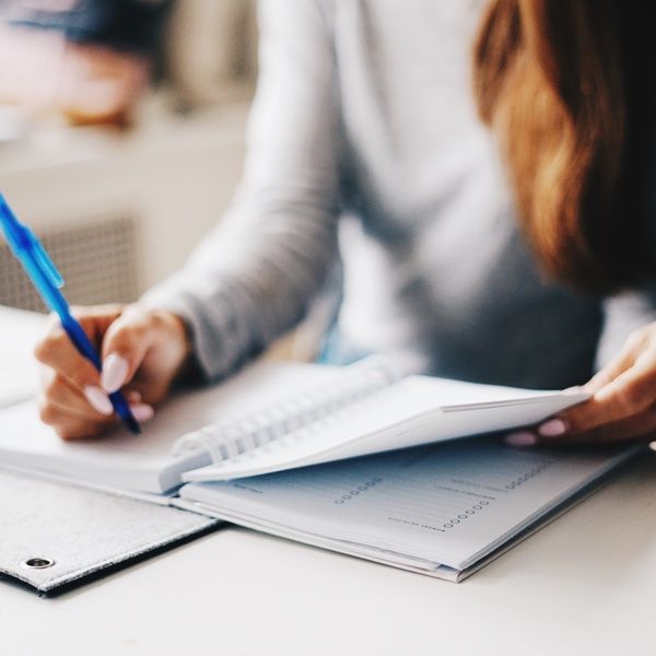 student taking notes