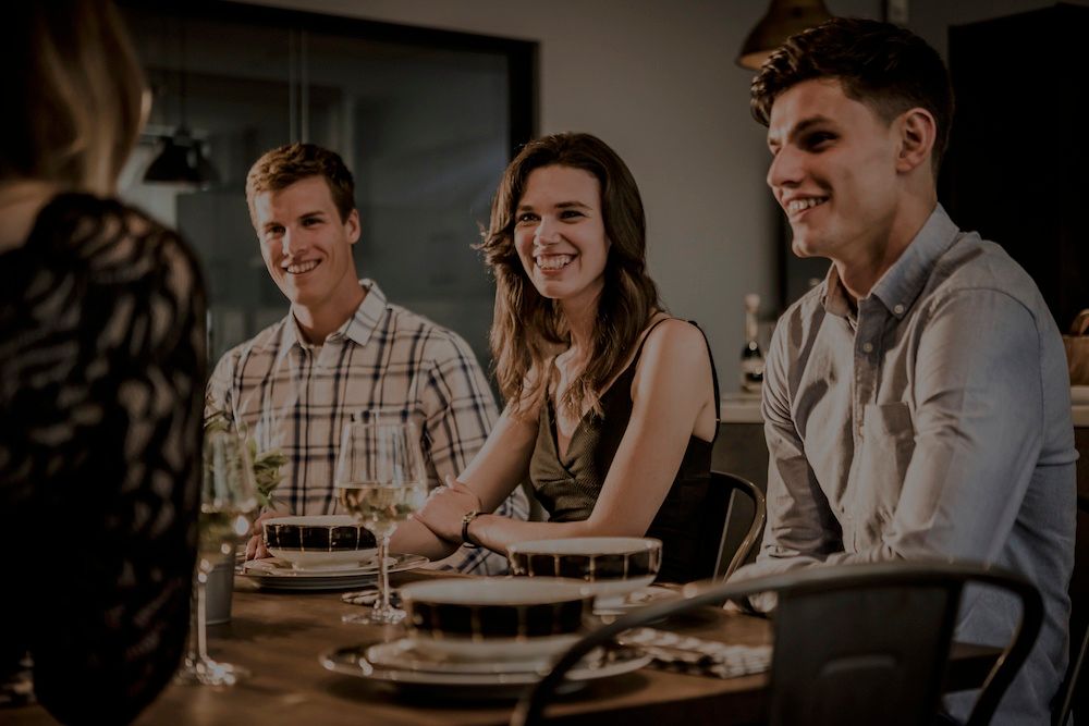 people sat at shared table in student accommodation