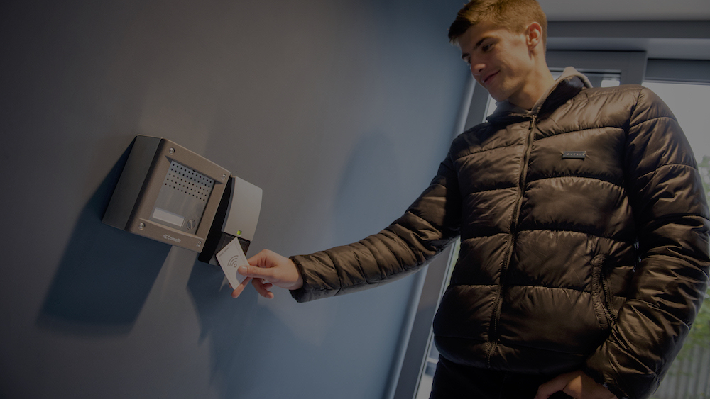 person scanning keycard in student accommodation