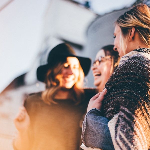 students laugh and talk happily
