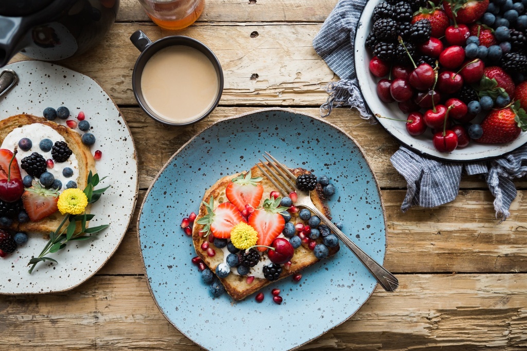 fruit on toast and bowl of cherries