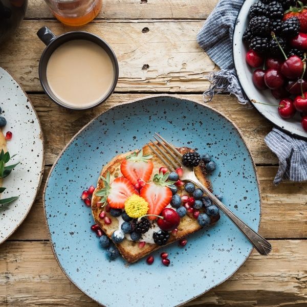 fruit on toast and bowl of cherries