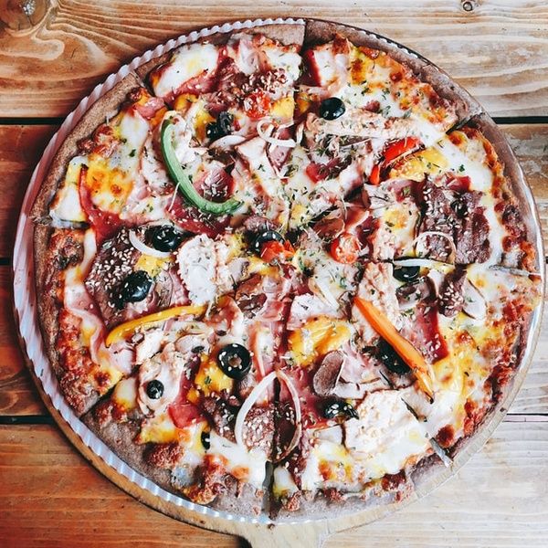 sliced pizza on board