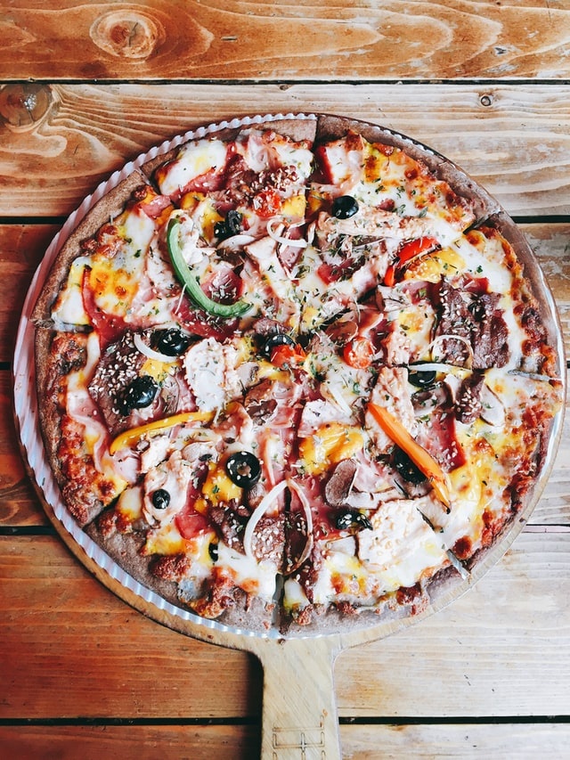 sliced pizza on board
