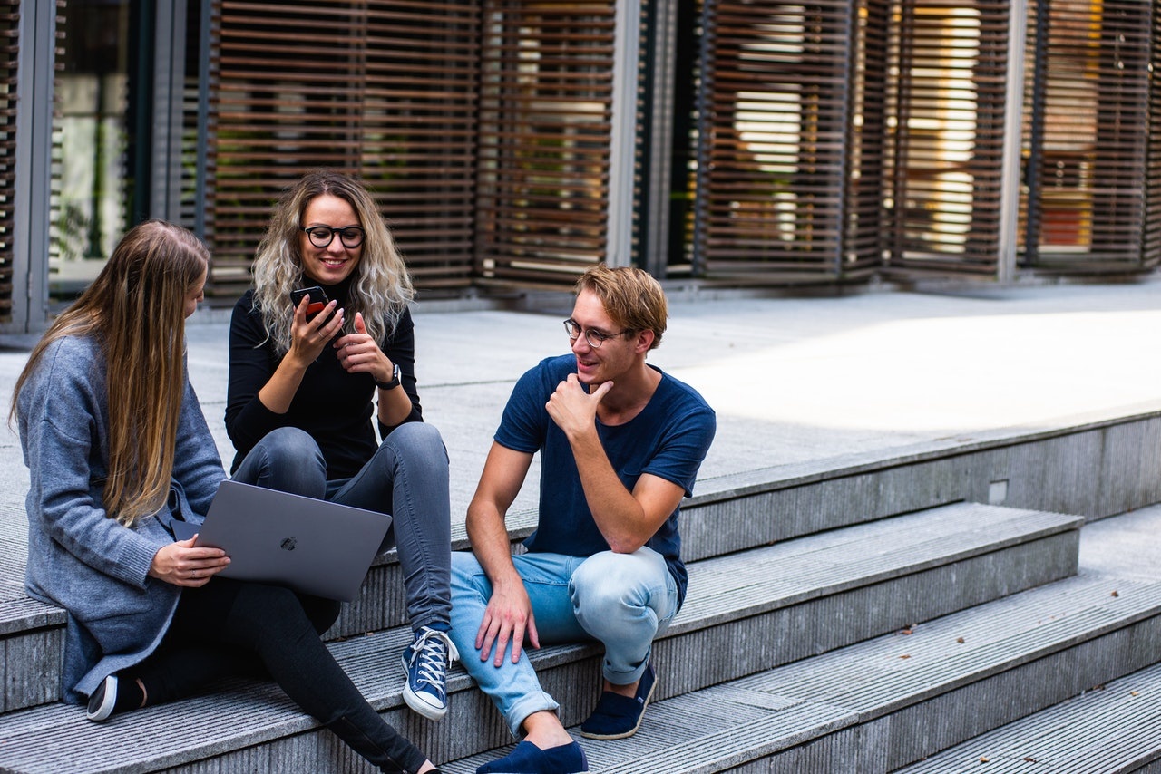 students sitting on steps