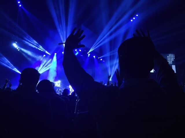 lasers on dance floor with hands up