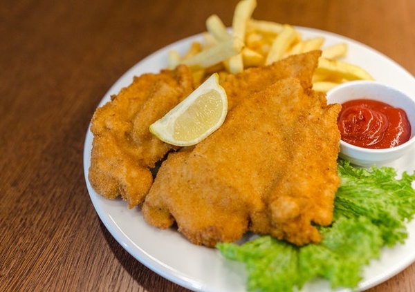 fish and chips with ketchup and lettuce