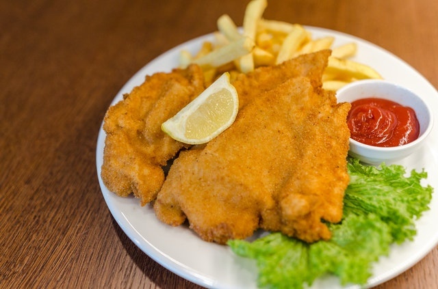 fish and chips with ketchup and lettuce