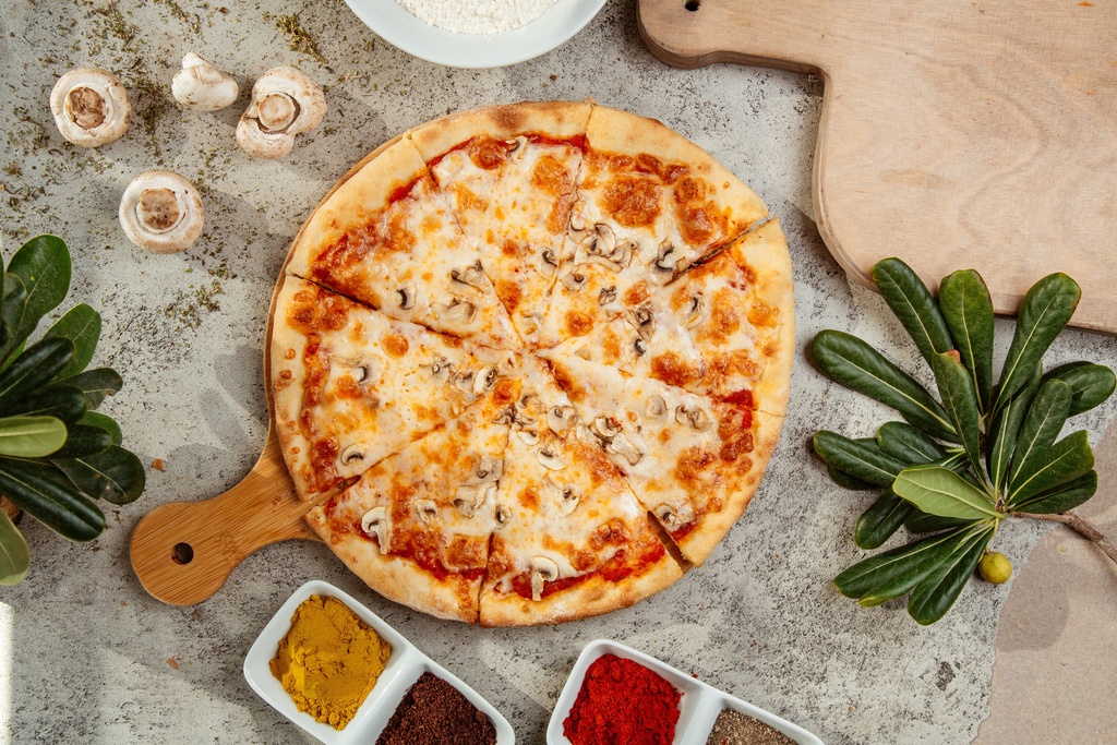pizza on board with mushrooms