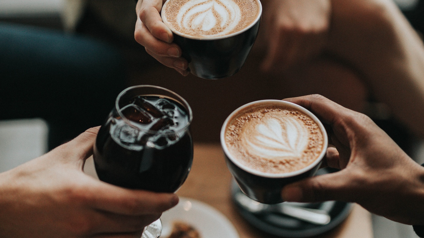 students with coffee cups