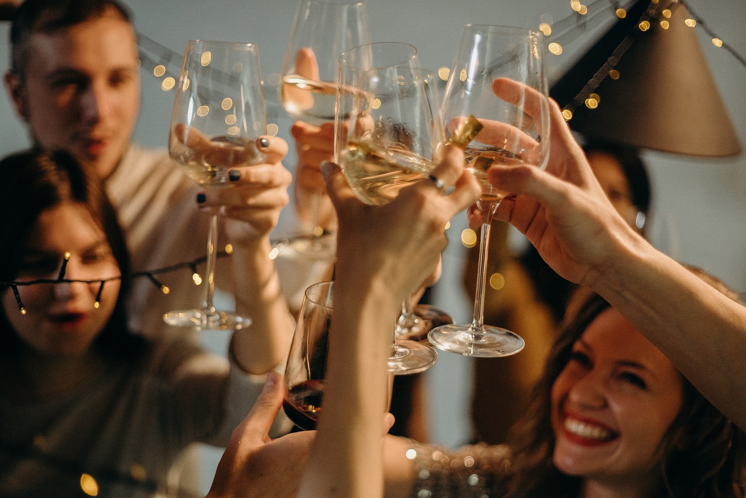 students cheers wine glasses