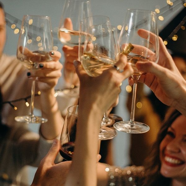 students cheers wine glasses