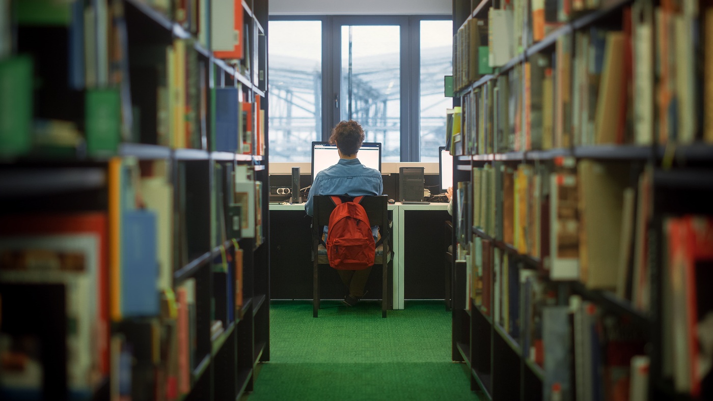 student studying in library