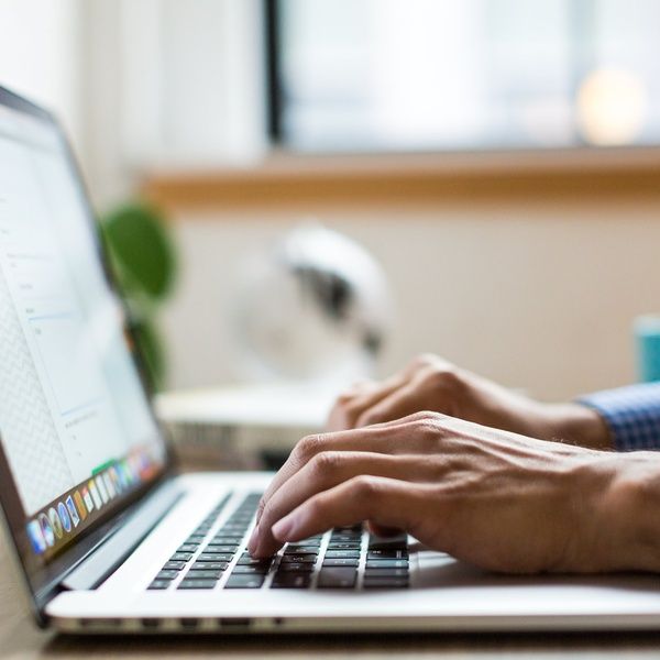 Typing on laptop