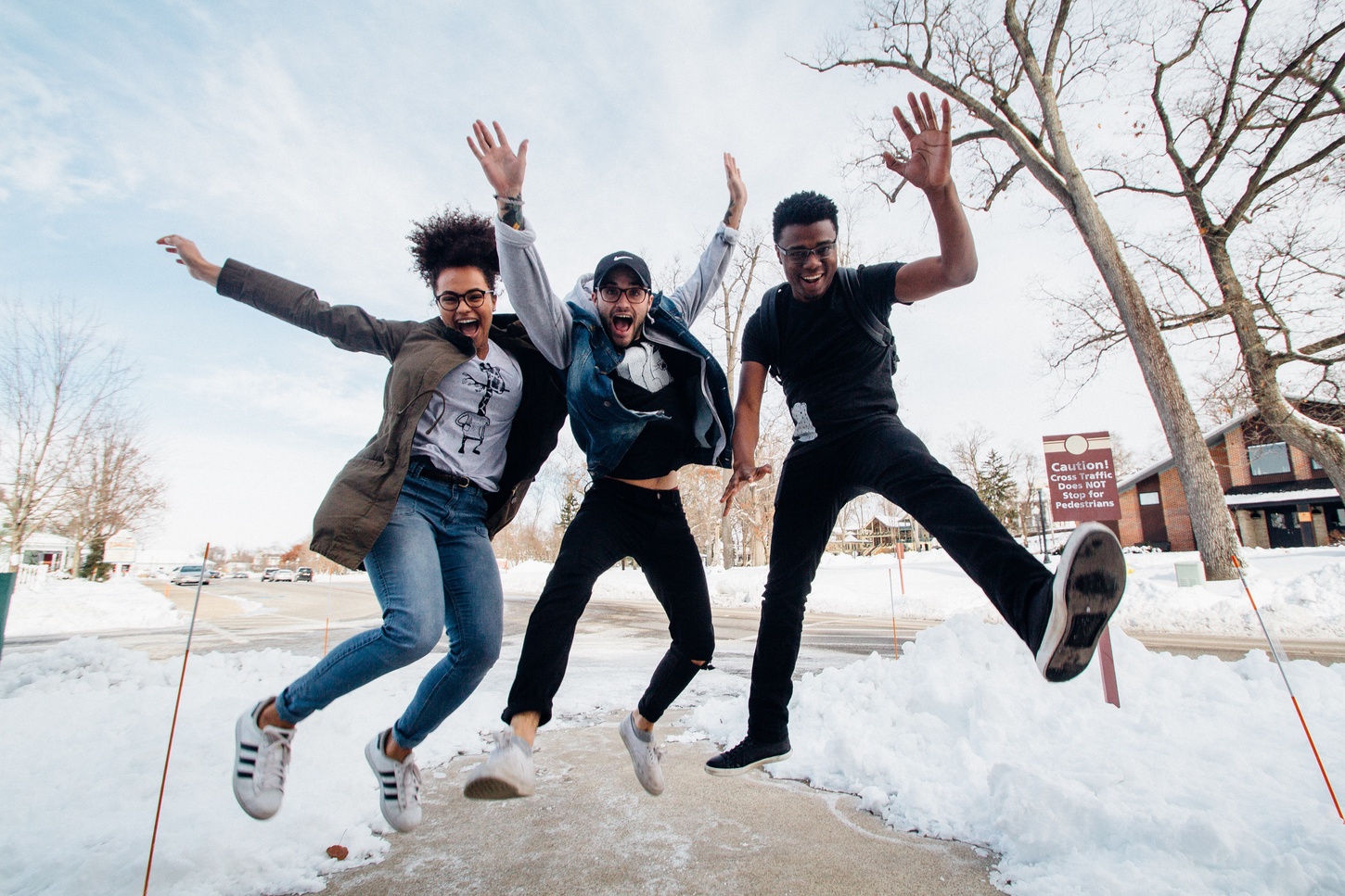 students jumping in snow