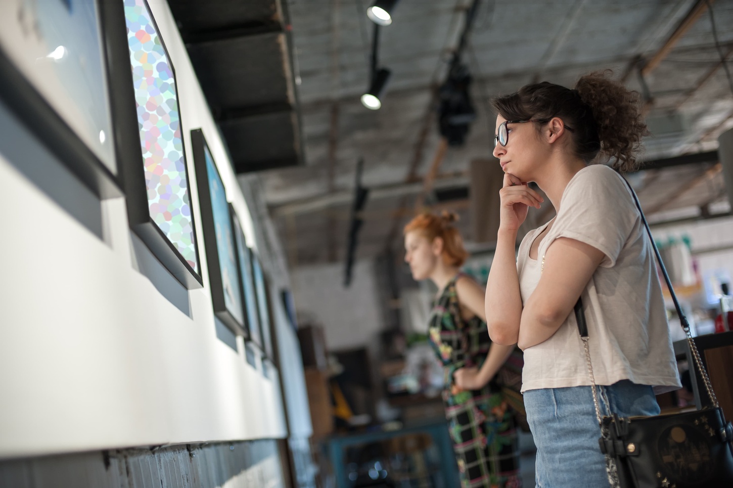 student looking at museum exhibition