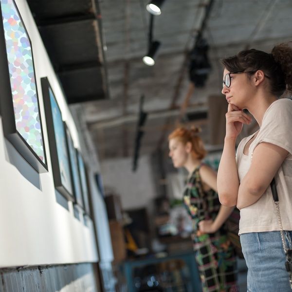 student looking at museum exhibition