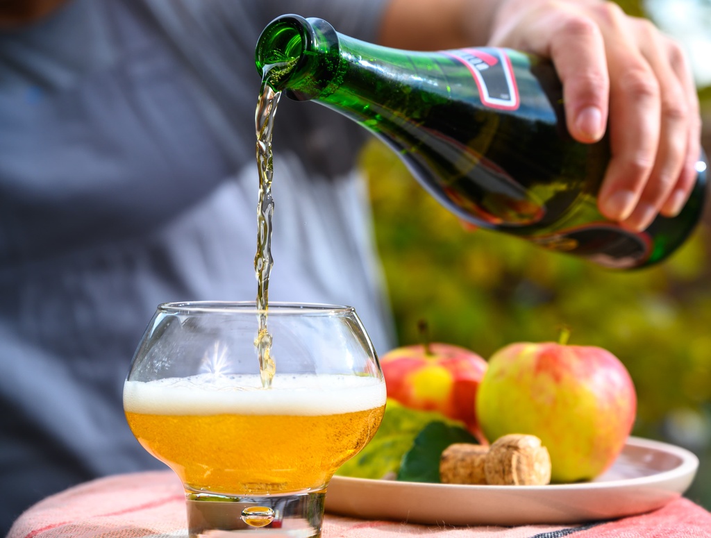 cider being poured in garden