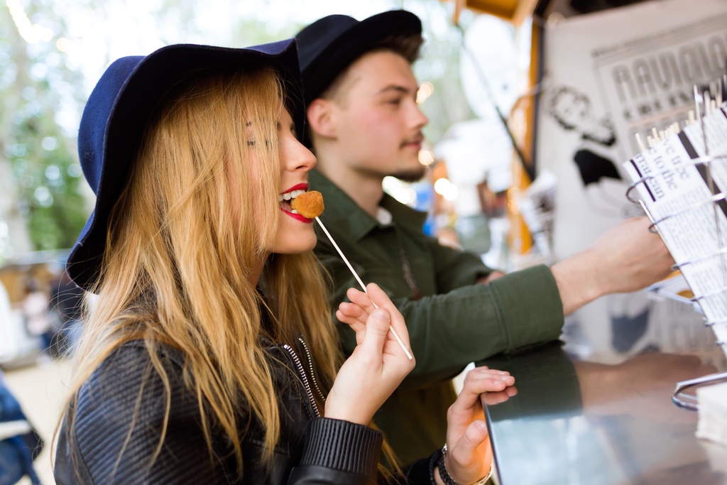 student at street food stall