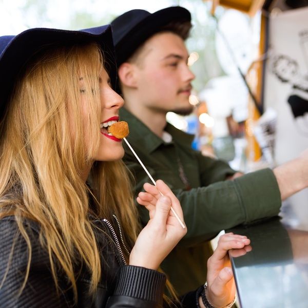 student at street food stall
