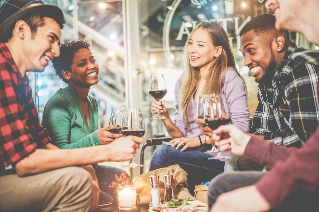 students drinking wine in student bar