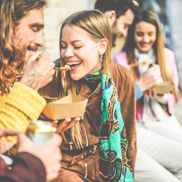 students eating street food