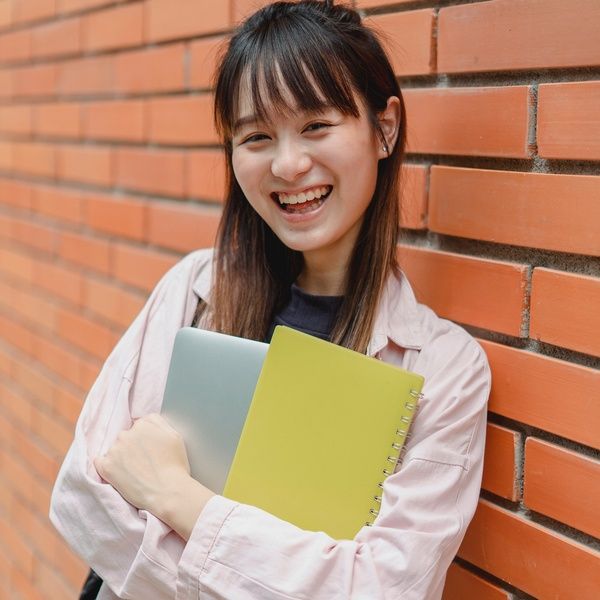 University Student happy with textbooks