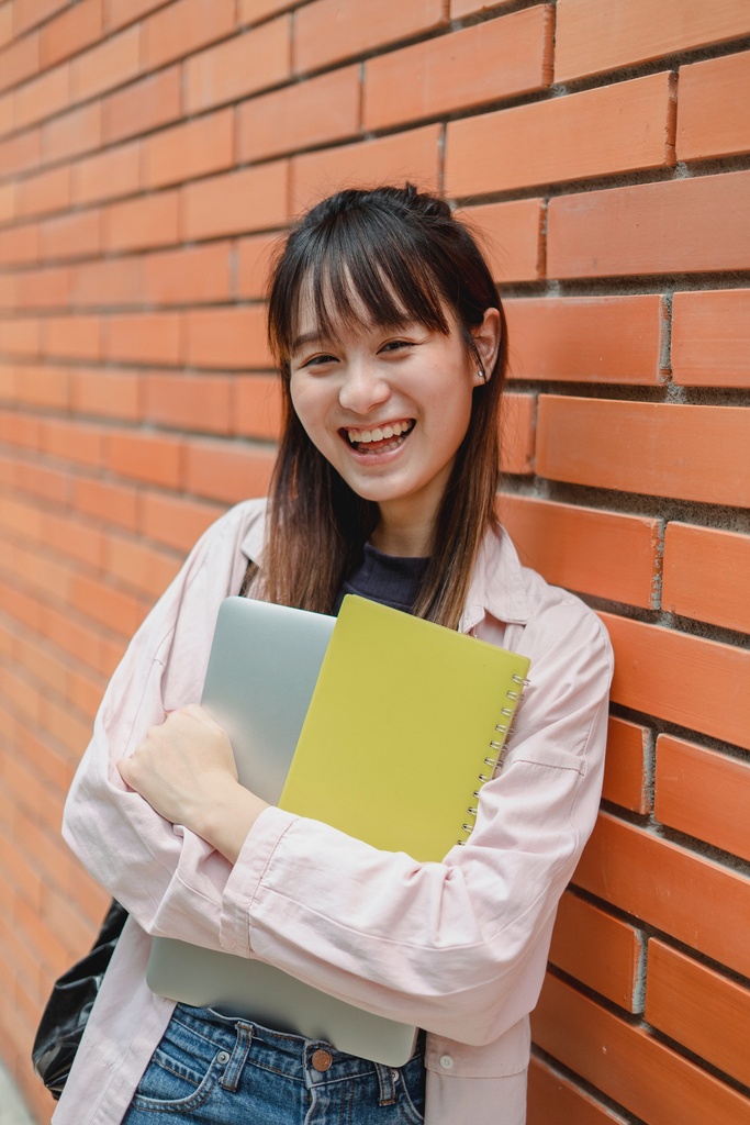 University Student happy with textbooks