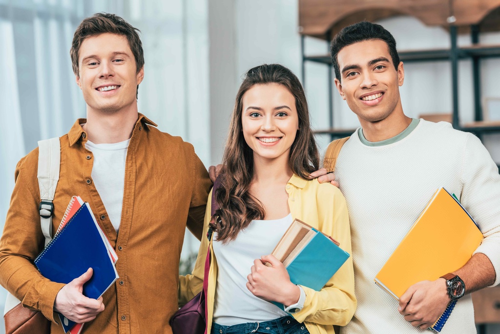 students with text books at uni open day