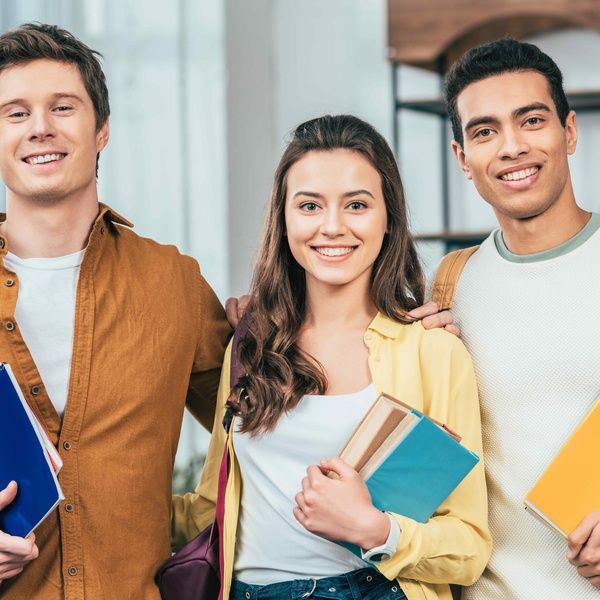 students with text books at uni open day