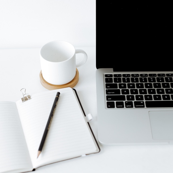 student laptop, notebook and coffee cup