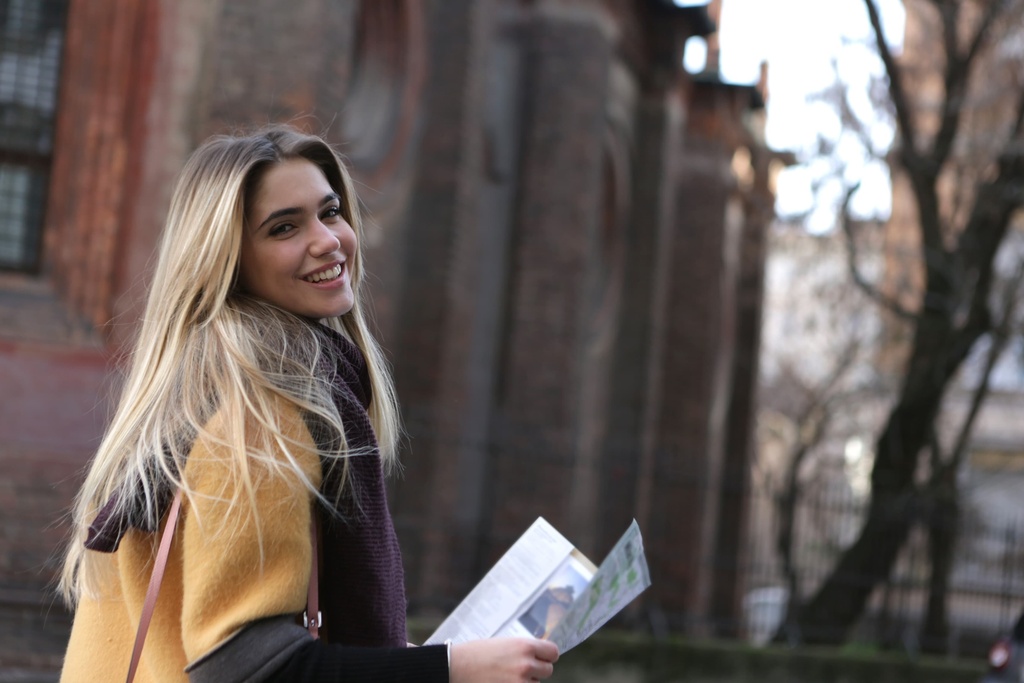 university student reading map on campus