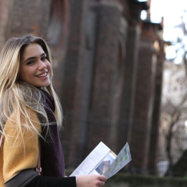 university student reading map on campus