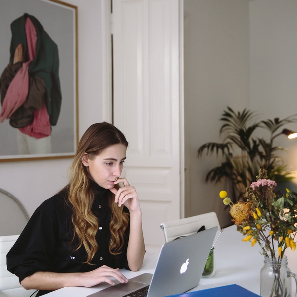 student sitting in front of a laptop