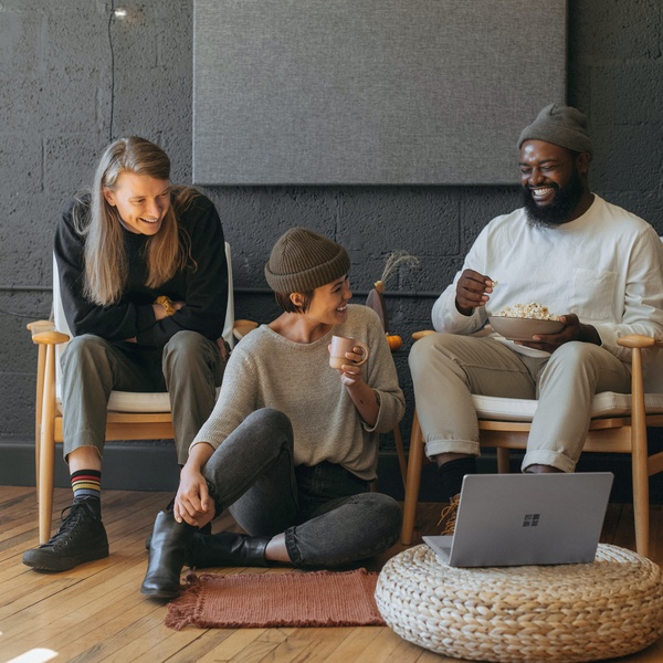 students laughing in living room