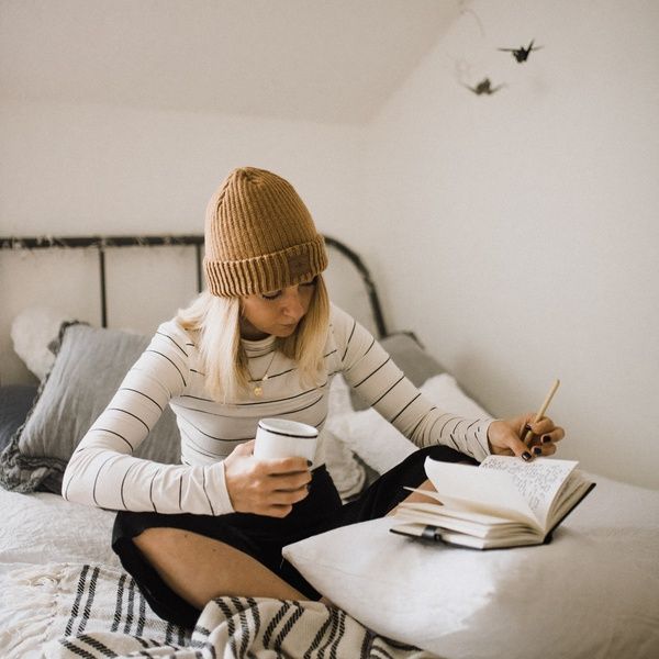 student sat on bed