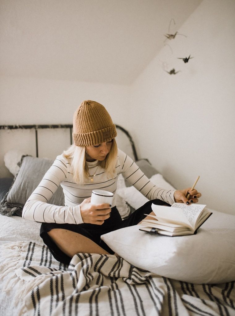 student sat on bed