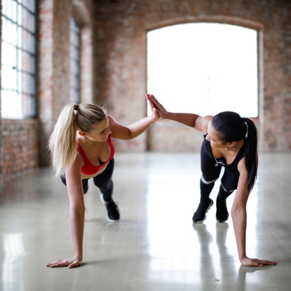 Two women planking