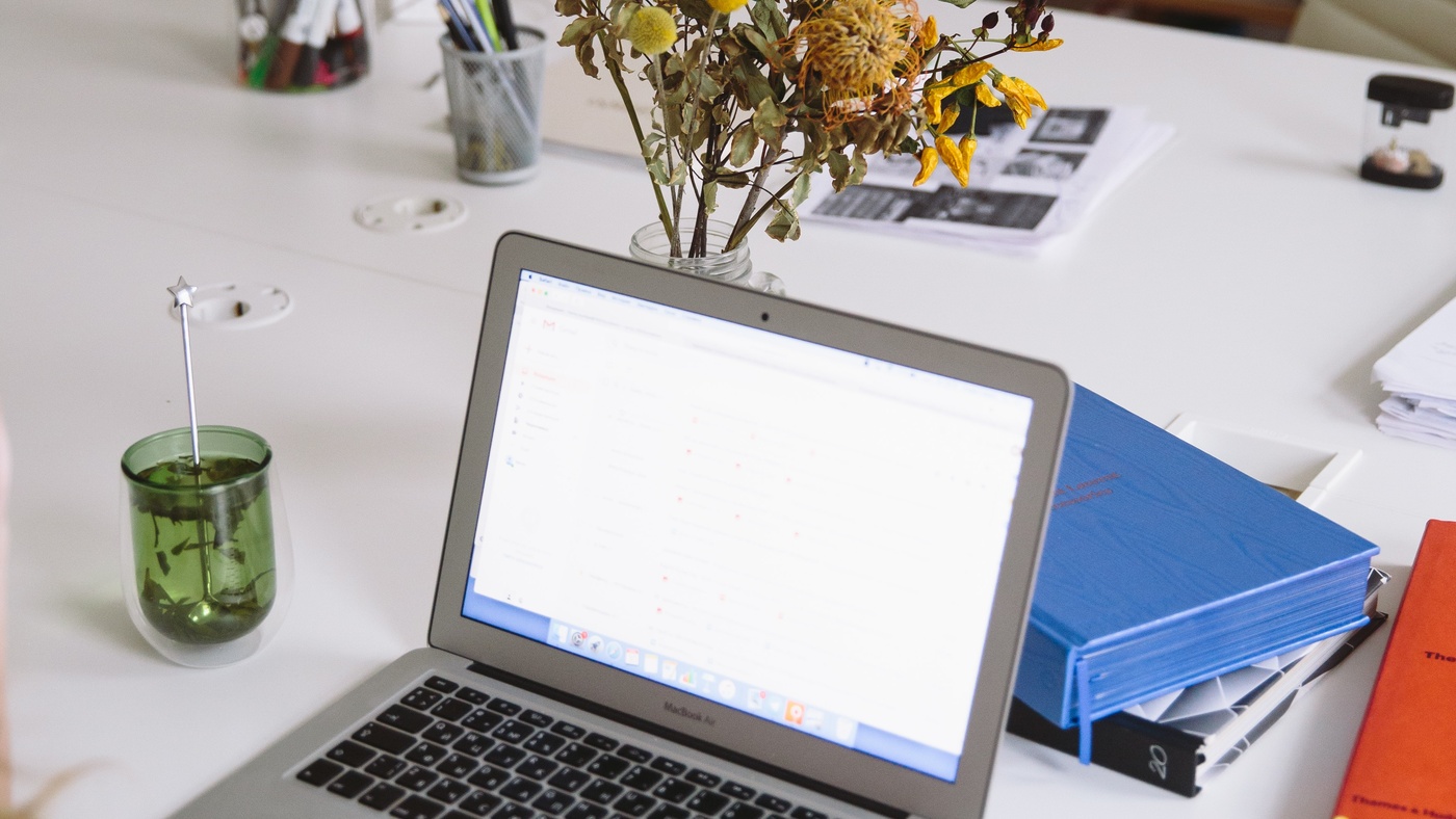 Person using mouse on a laptop